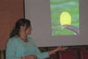 Thumbnail of Sunny Holcomb gesturing to her presentation