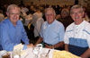 A thumbnail of three men seated at a table